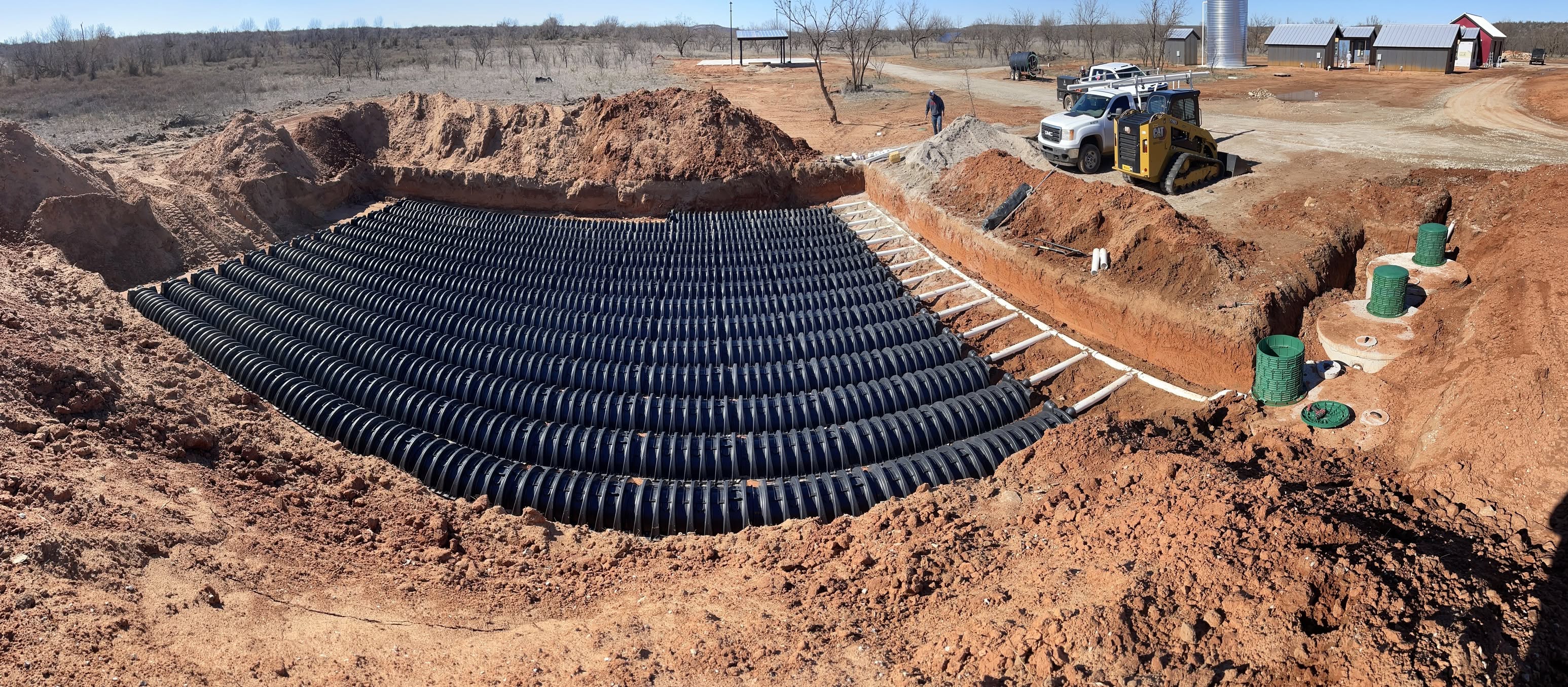West Texas Plumbing Solutions crew installing a large leaching chamber field